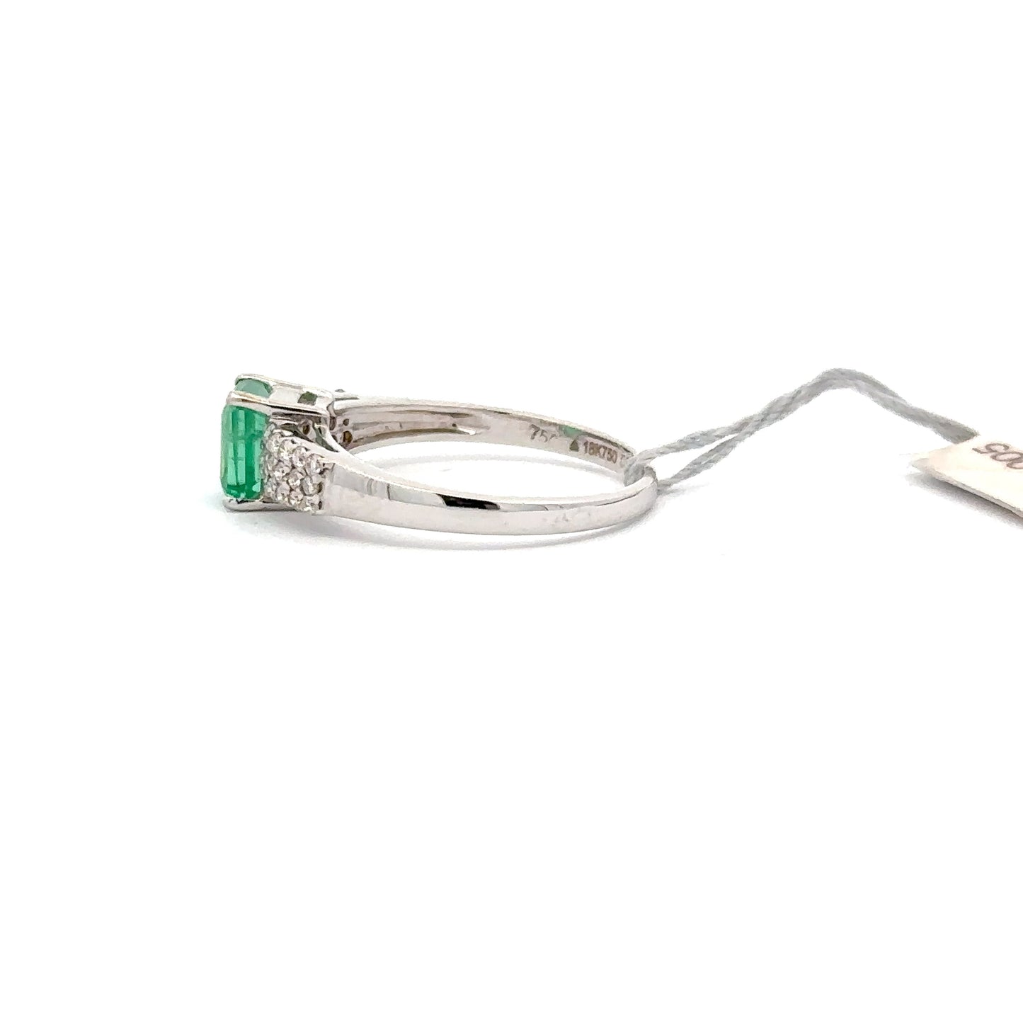 0.75 ct Natural Emerald Center | 0.25 ct Natural Side Diamonds | 18k White Gold.