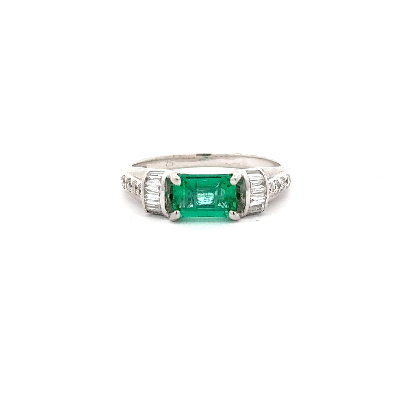 Beautiful Emerald Ring set in 18k White Gold With Baguette and Round Diamonds.