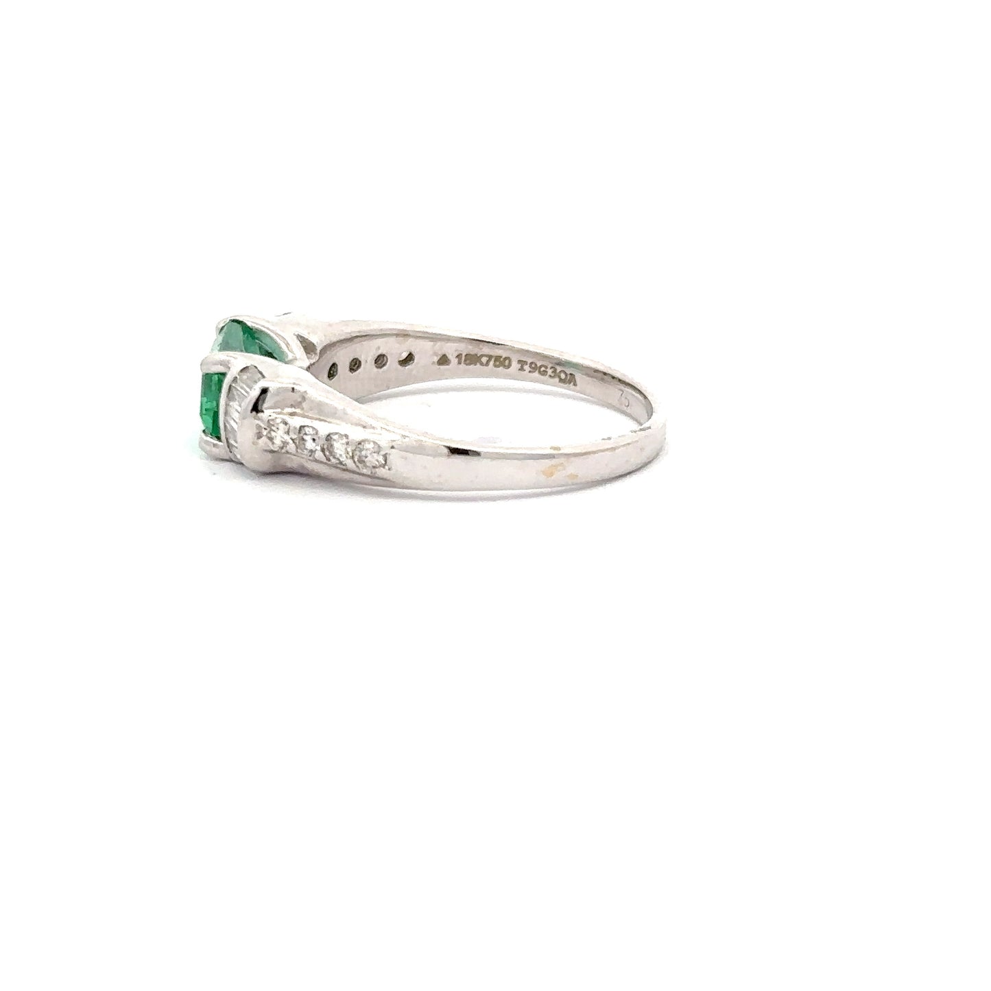 Beautiful Emerald Ring set in 18k White Gold With Baguette and Round Diamonds.