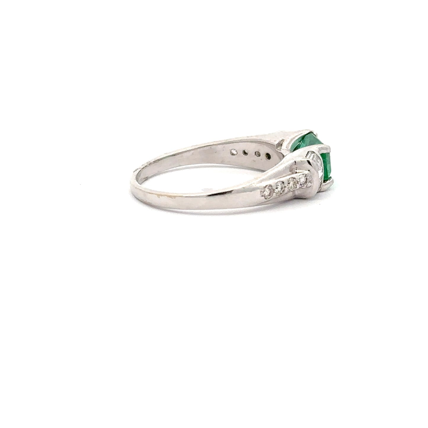 Beautiful Emerald Ring set in 18k White Gold With Baguette and Round Diamonds.