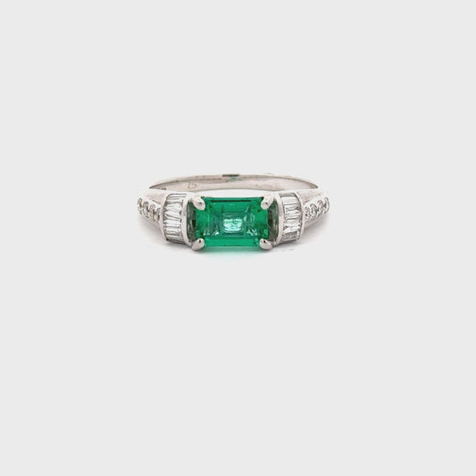 Beautiful Emerald Ring set in 18k White Gold With Baguette and Round Diamonds.